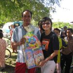 Presenting a food hamper to an egg collector