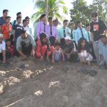 Villagers releasing terrapins