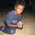 Alam was observing the hatchlings so closely and wanted so badly to have a pic taken with one